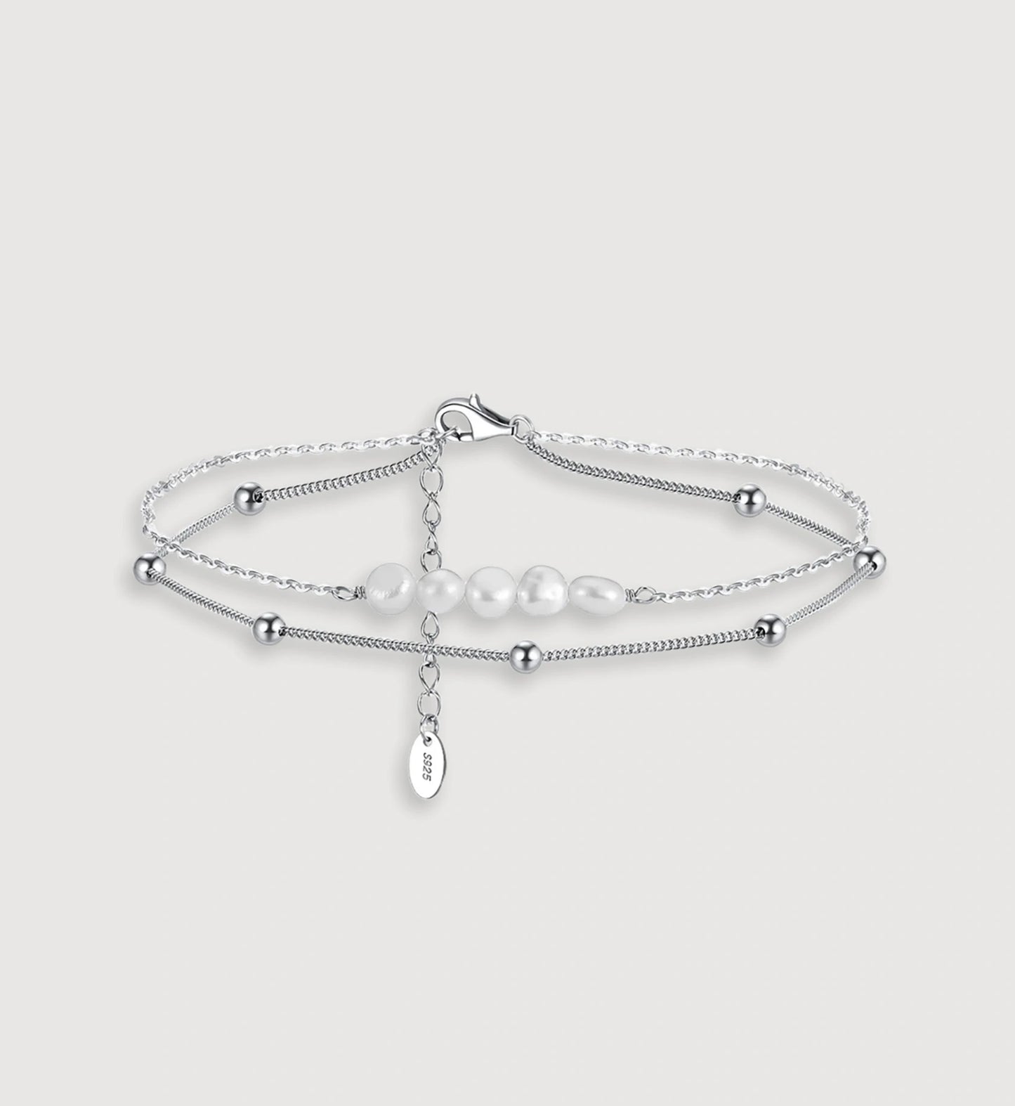 Hypoallergenic 925 sterling silver Boho Natural Pearl Anklet in light gray background by Liora Senar