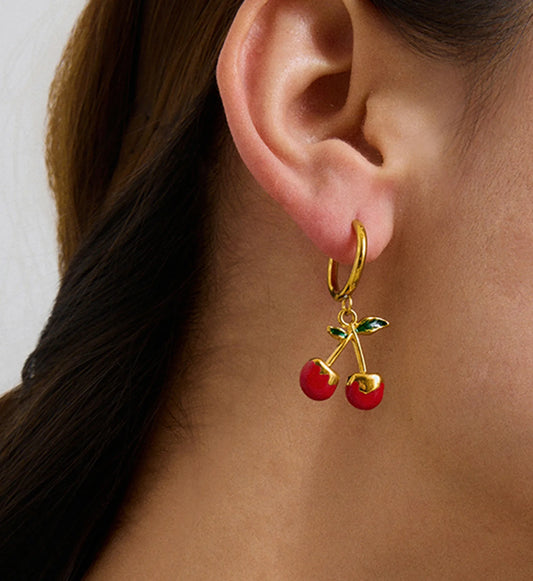 Model wearing hypoallergenic cherry kiss hoop earrings by Liora Senar