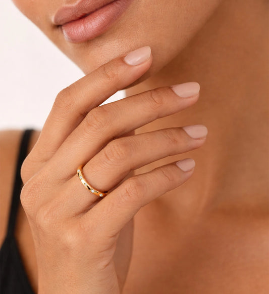 Model wearing stainless steel Eterna Dot Ring by Liora Senar