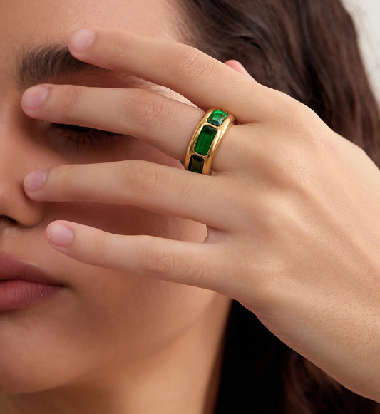 Close-up shot of model wearing gold color warranty Geo Lumina Ring by Liora Senar