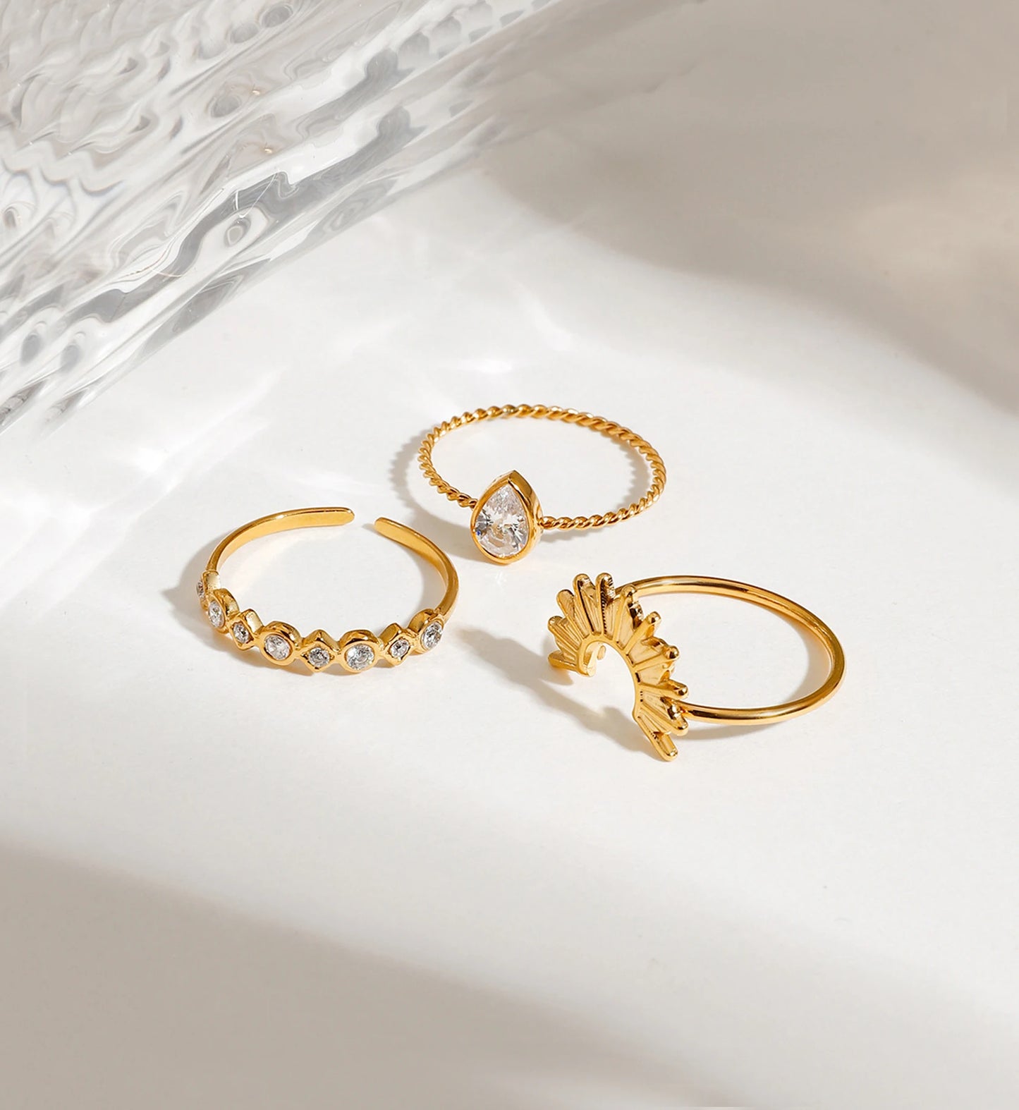 3 pieces of tarnish-free Halo Stack Ring Set seperately laying on white background by Liora Senar