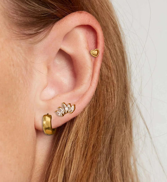 Hypoallergenic versatile heart earrings set on a model by liora senar