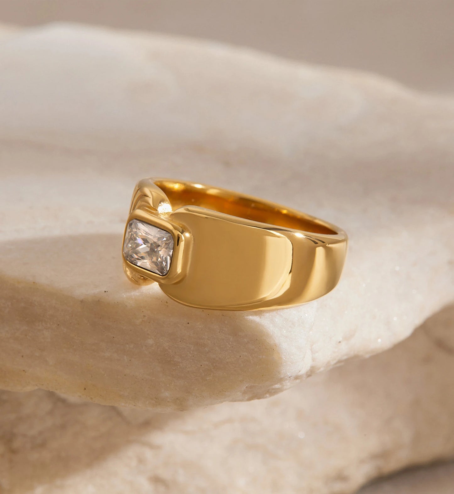 Side face of gold stainless steel Aurelia Ring on a stone by Liora Senar
