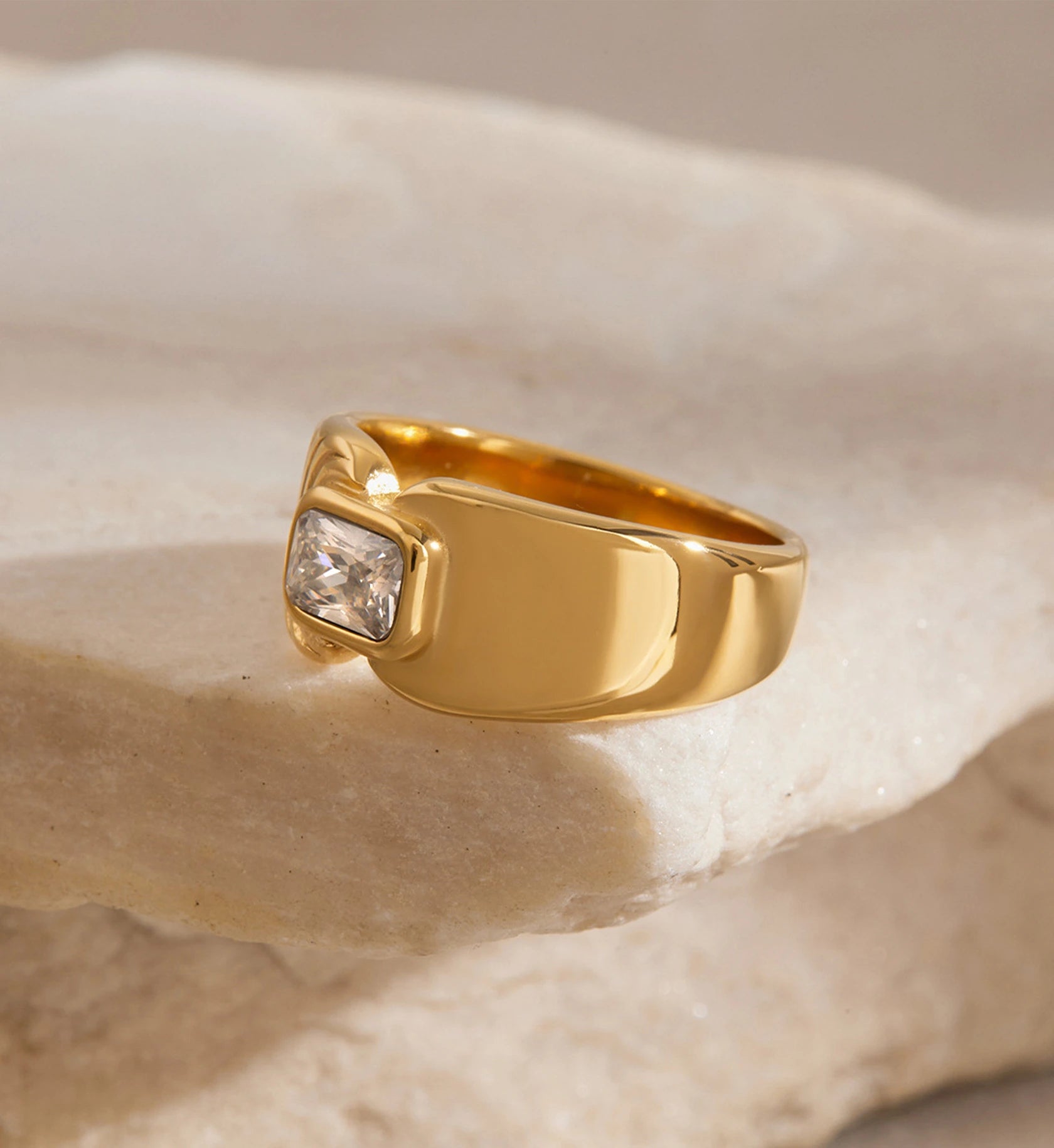 Side face of gold stainless steel Aurelia Ring on a stone by Liora Senar
