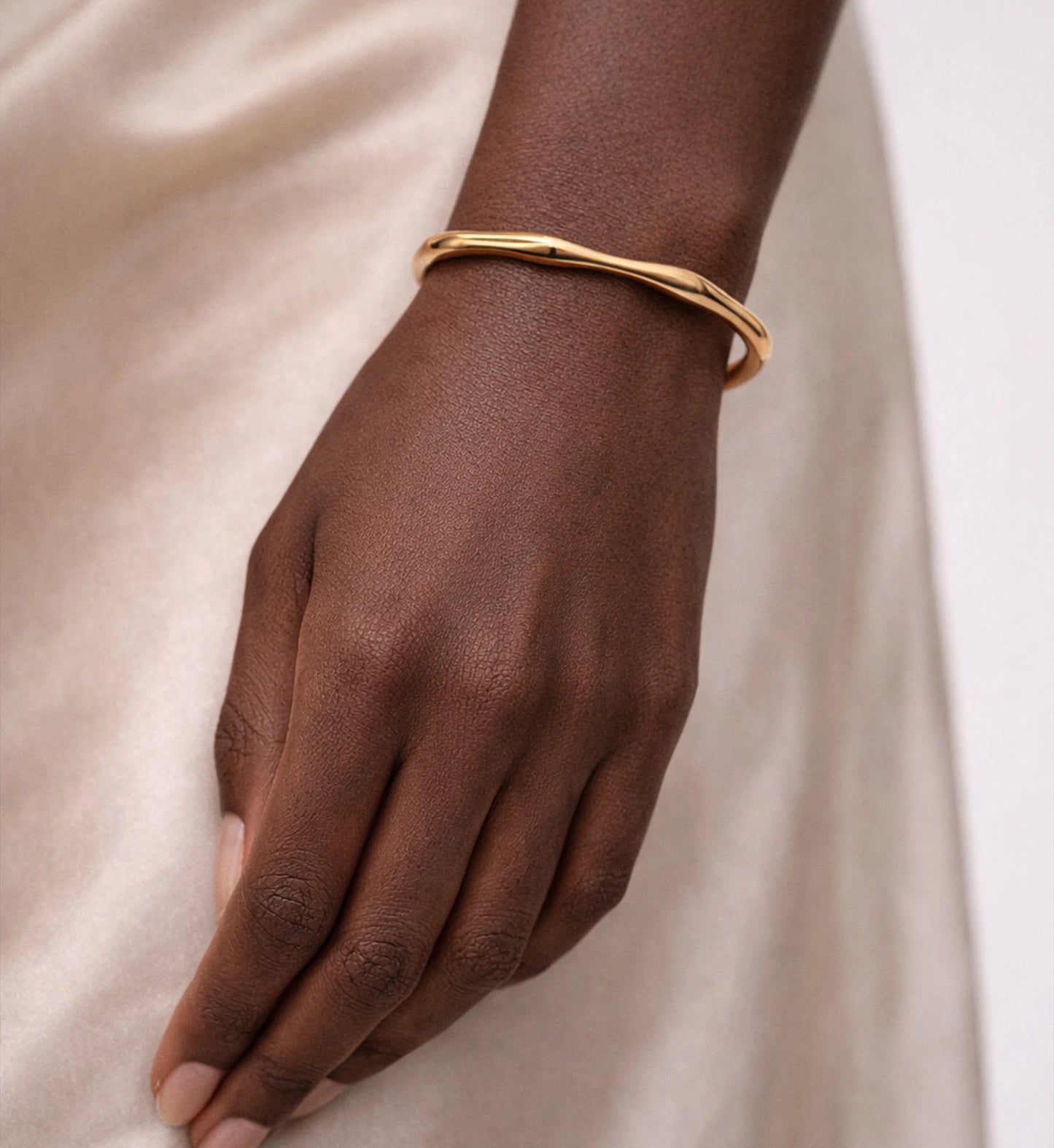 Close-up shot of Aurelian Flow Cuff on a model by Liora Senar