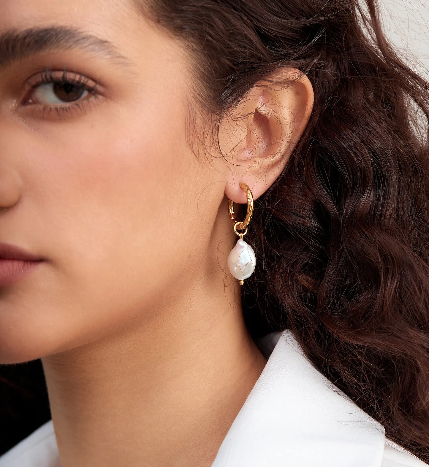 Natural color warranty Baroque Pearl Hoop Earrings on Model‘s side face by Liora Senar