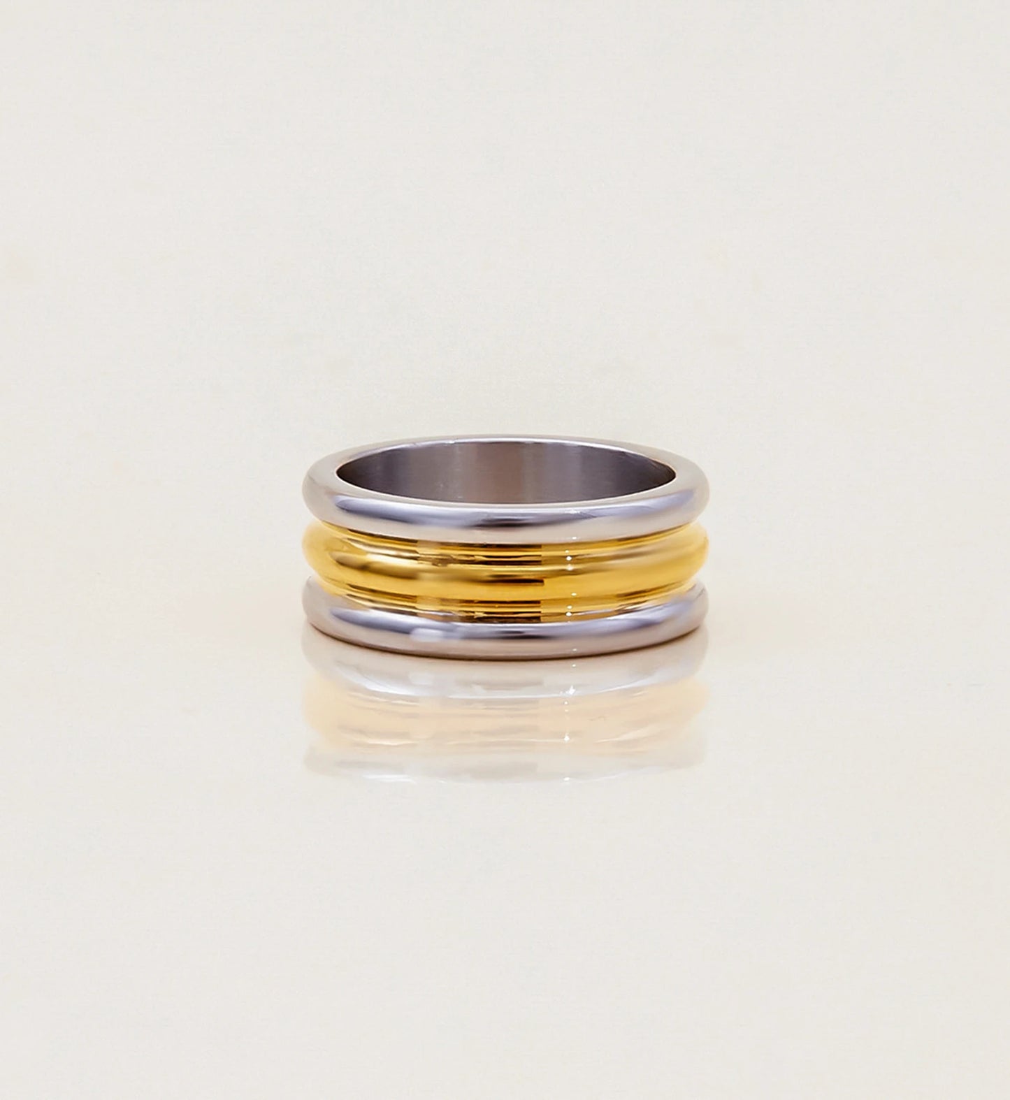 Minimalist stainless steel Bi-Stream Band Ring in light gray background by Liora Senar