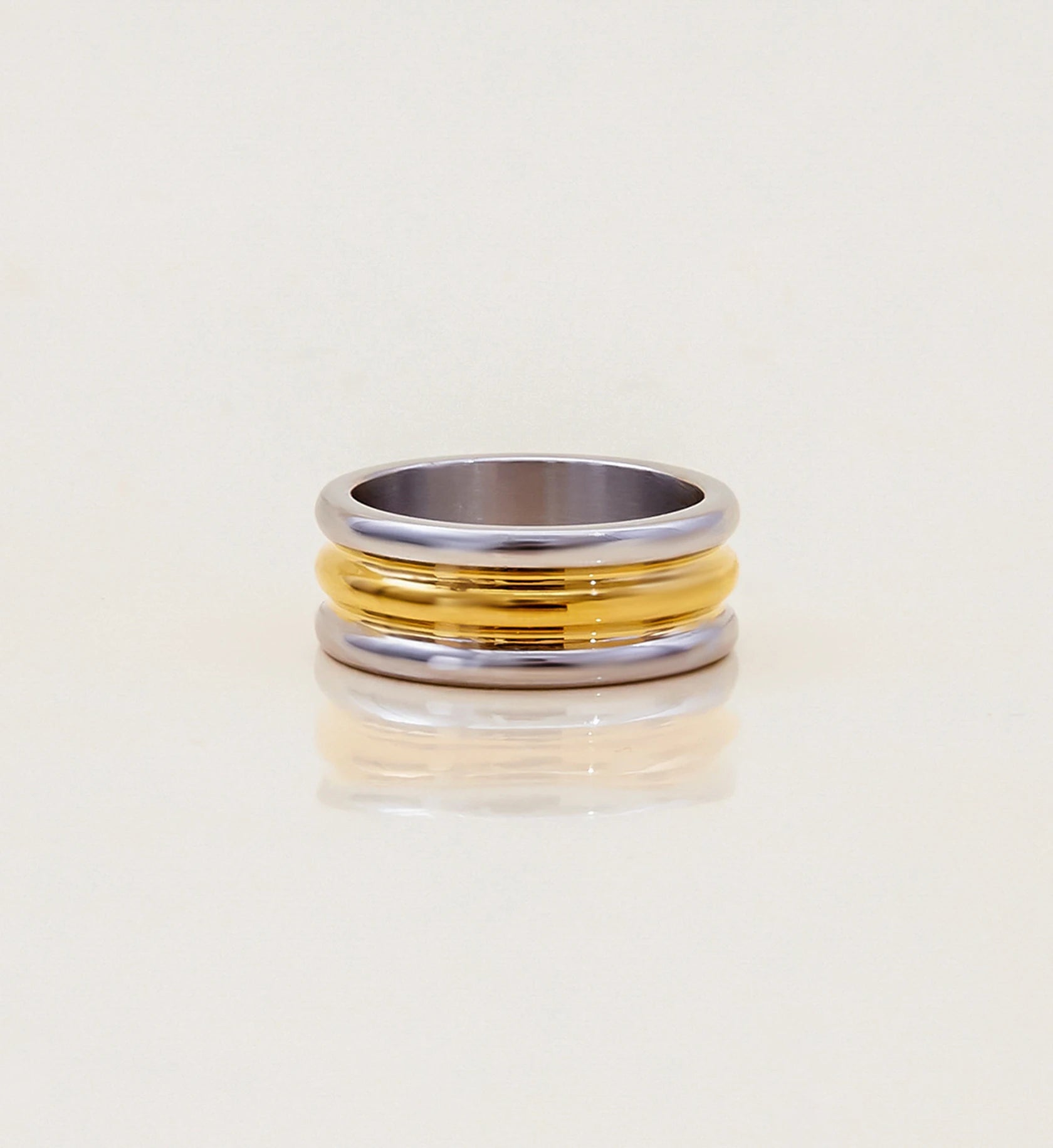 Minimalist stainless steel Bi-Stream Band Ring in light gray background by Liora Senar