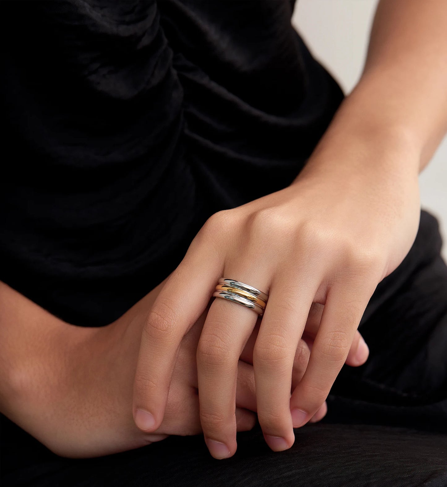 Model wearing Minimalist stainless steel Bi-Stream Band Ring by Liora Senar