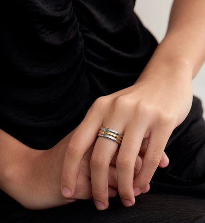 Model wearing Minimalist stainless steel Bi-Stream Band Ring by Liora Senar