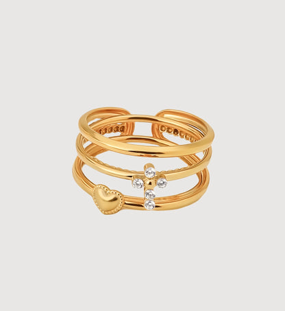 Gold stainless steel Cross-Heart Trio Ring Set in light gray background by Liora Senar