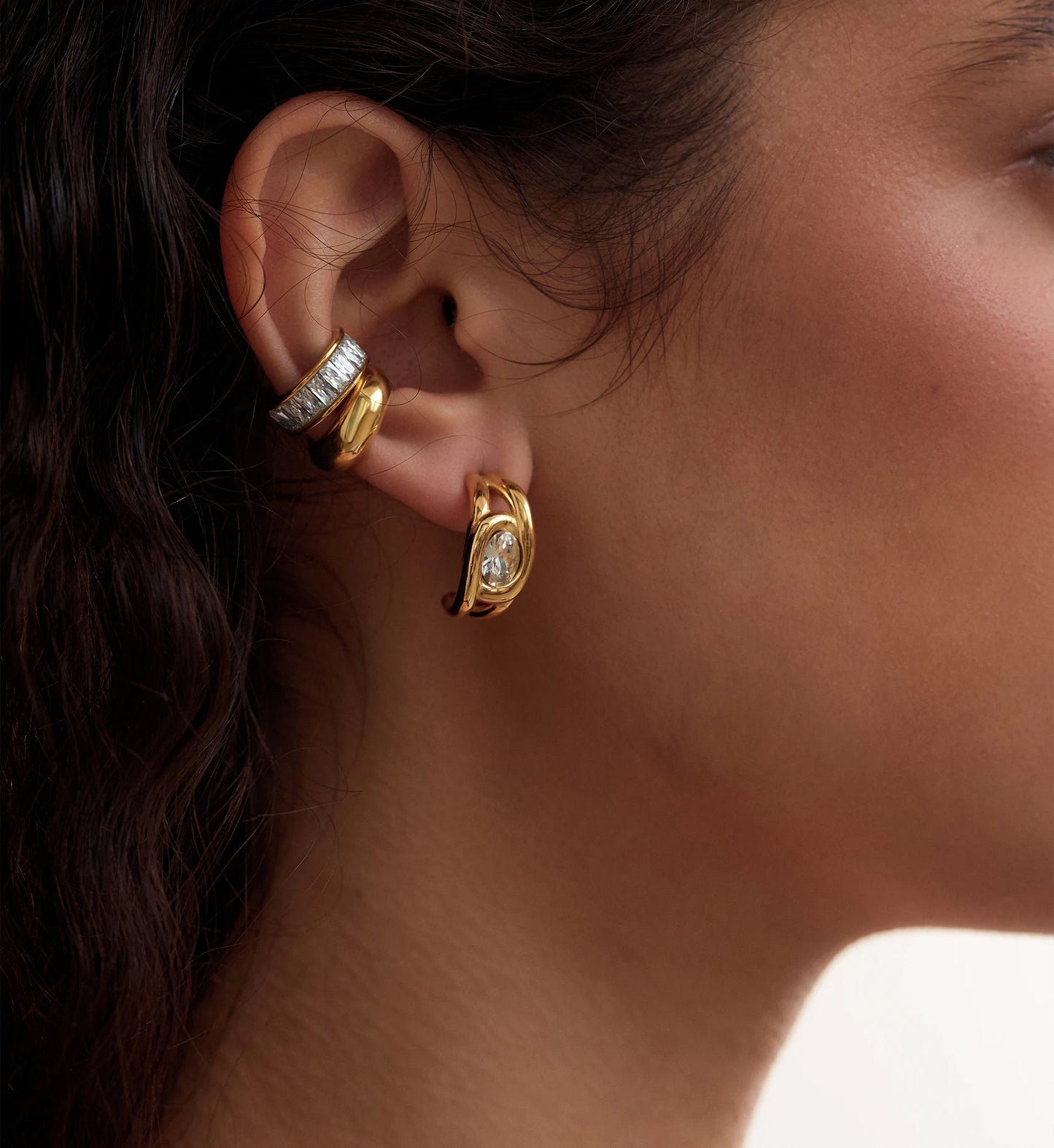 Close-up shot of stainless steel Gold Sparkle Earrings Bundle on a model by Liora Senar