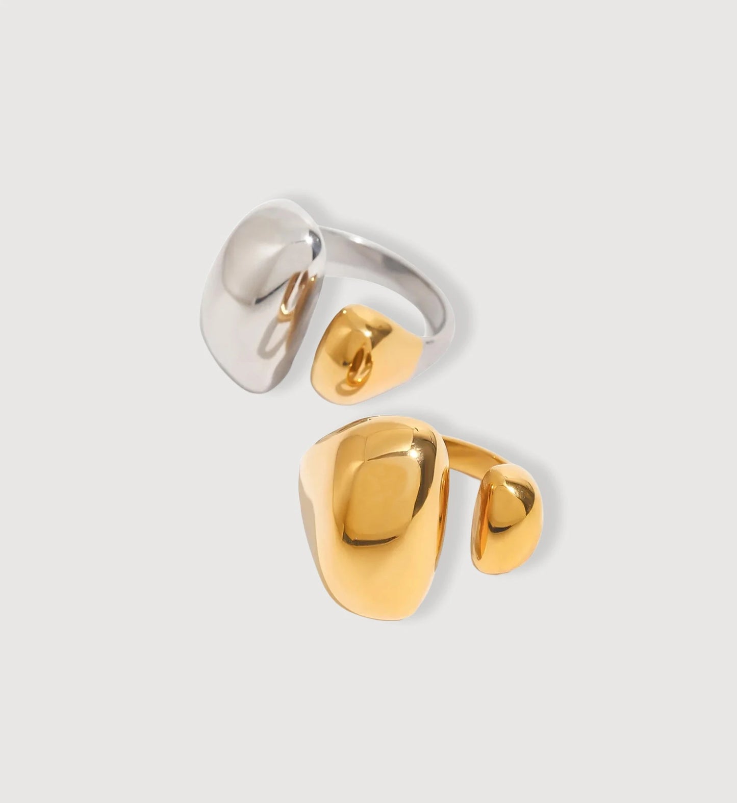 Gold and two-tone color Geo-Hue Ring in light gray background by Liora Senar