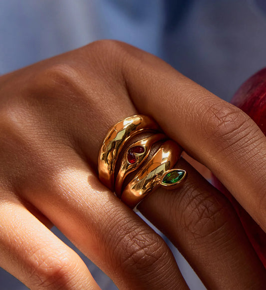 Model wearing gold tarnish-free Heart & Leaf Gem Stacking Rings by Liora Senar