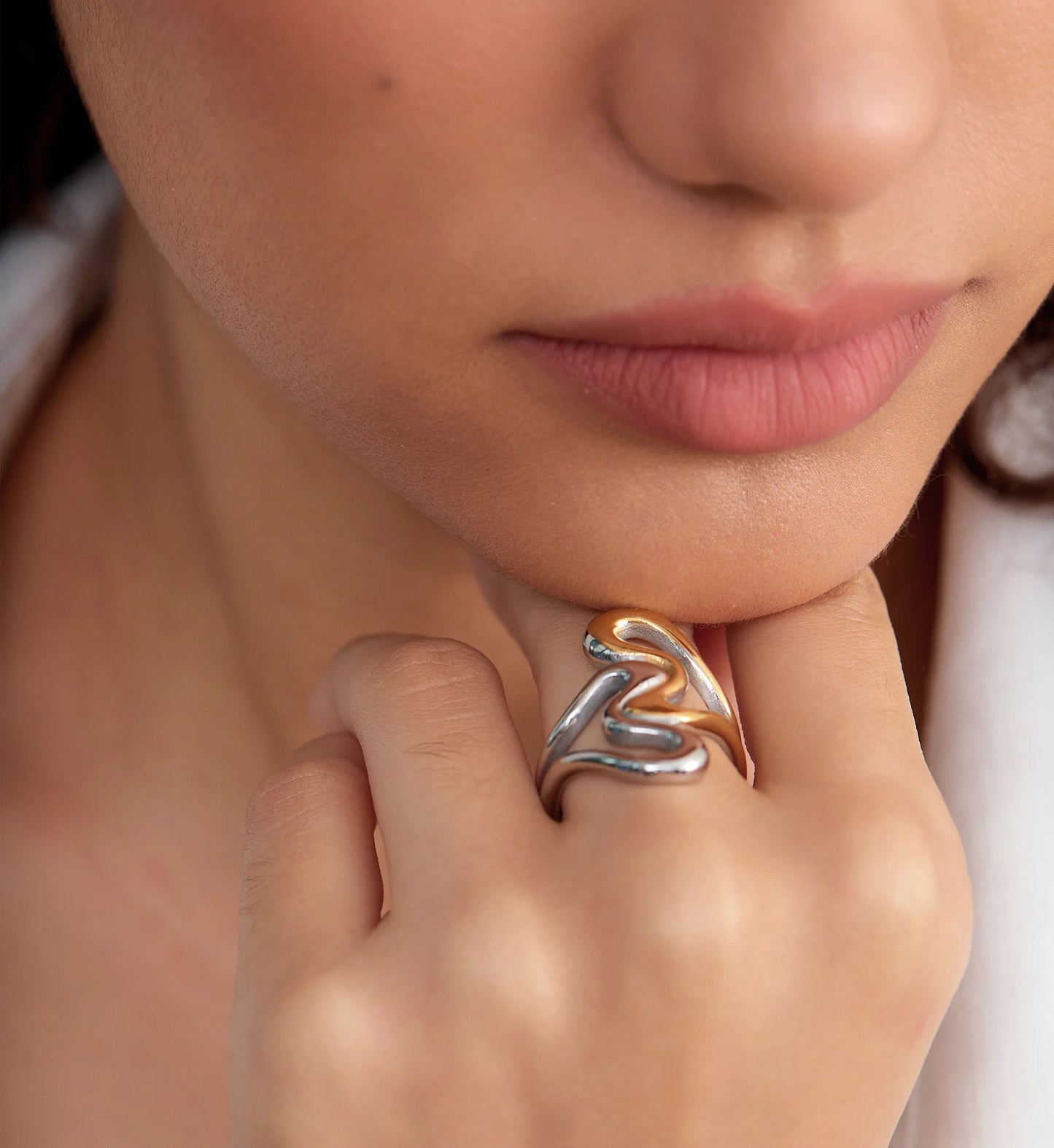 Close-up image of model wearing tarnish-free Heart To Heart Ring by Liora Senar