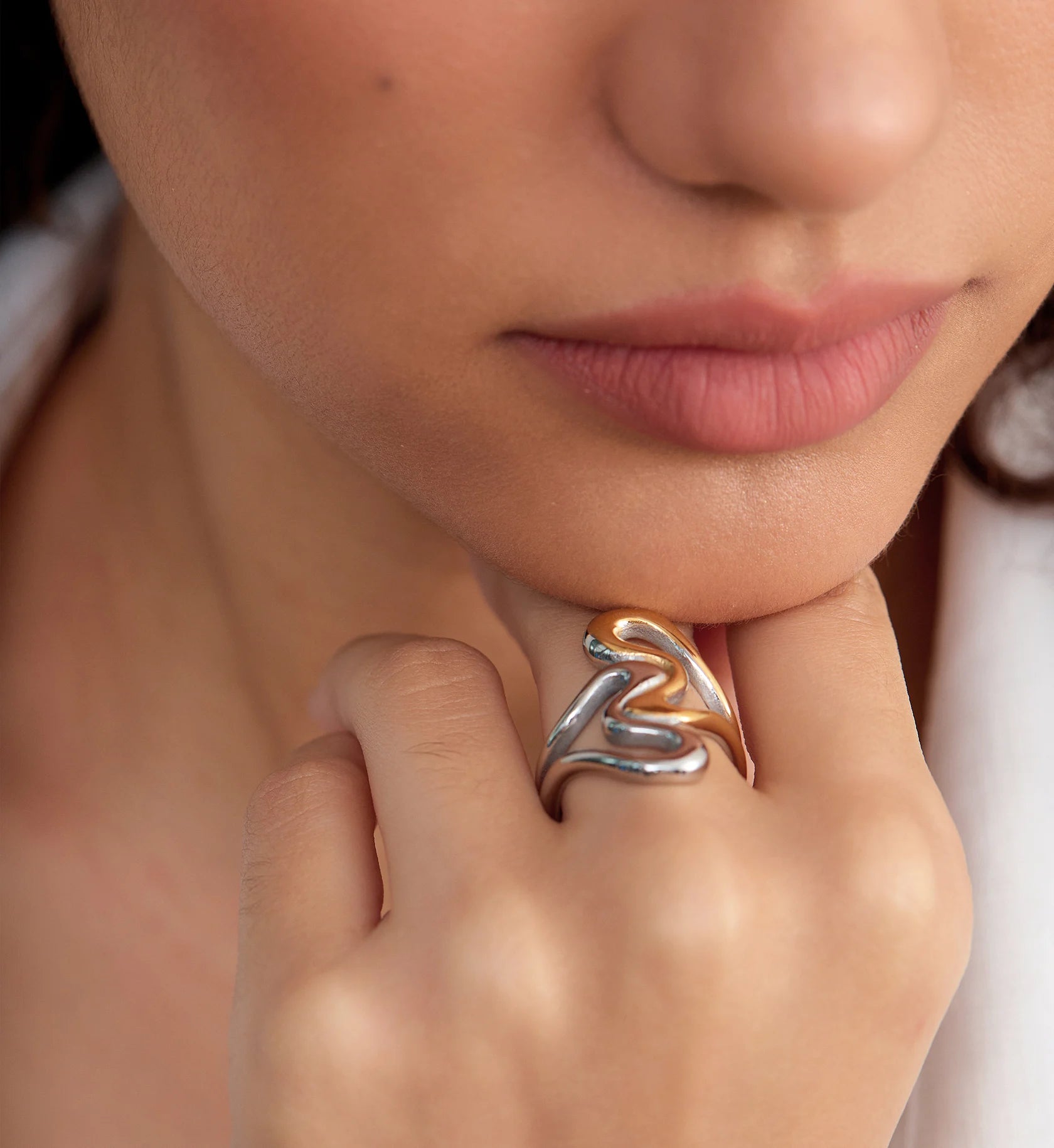 Close-up image of model wearing tarnish-free Heart To Heart Ring by Liora Senar