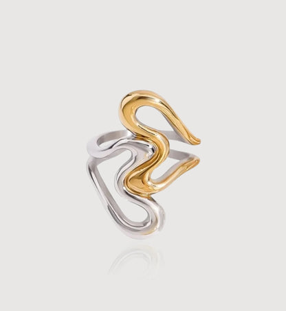 Gold-silver 2-tone stainless steel Heart To Heart Ring in light gray background by Liora Senar