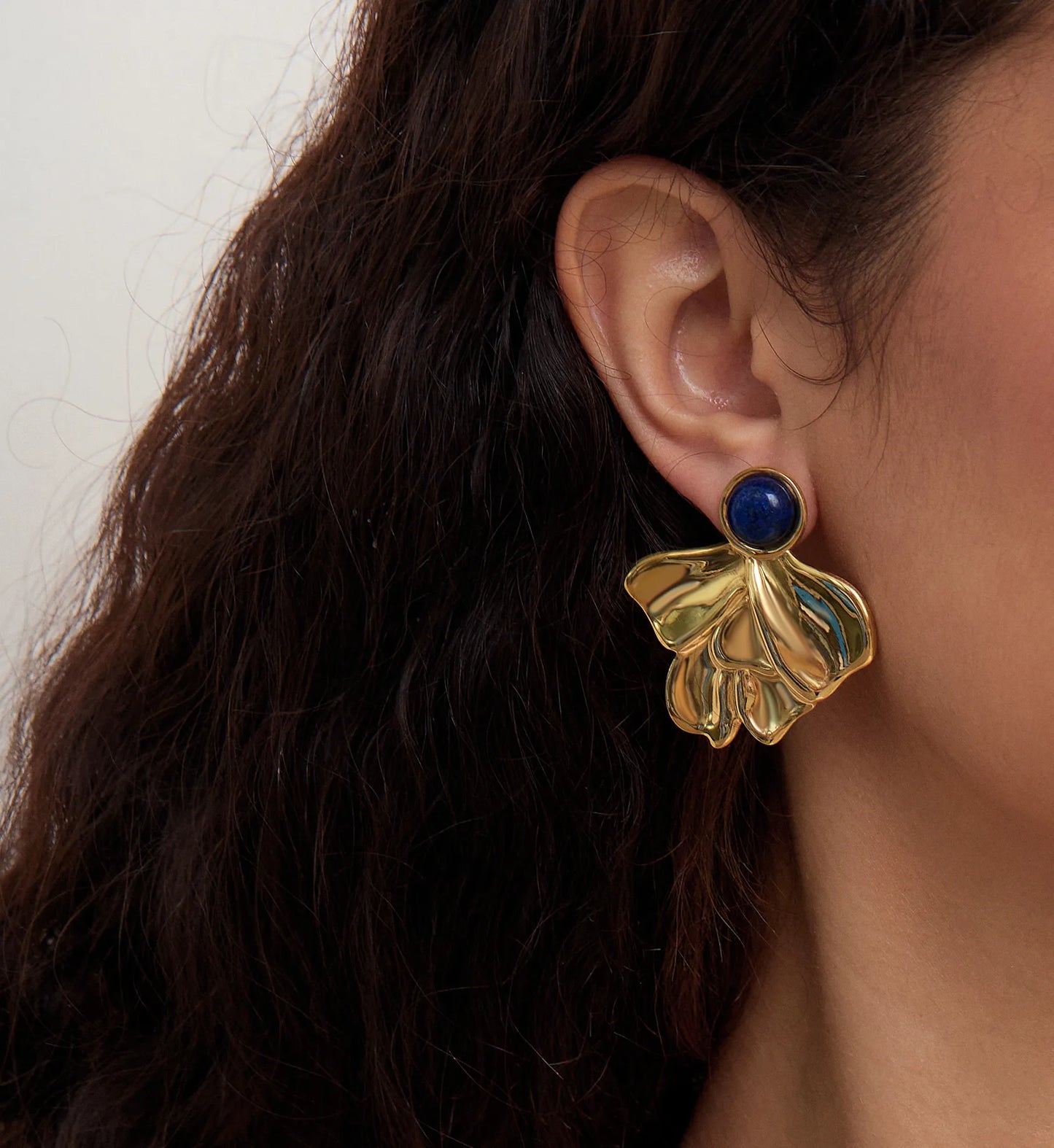 lapis flora earrings minimalist waterproof stainless steel jewelry on a model clearly by Liora Senar