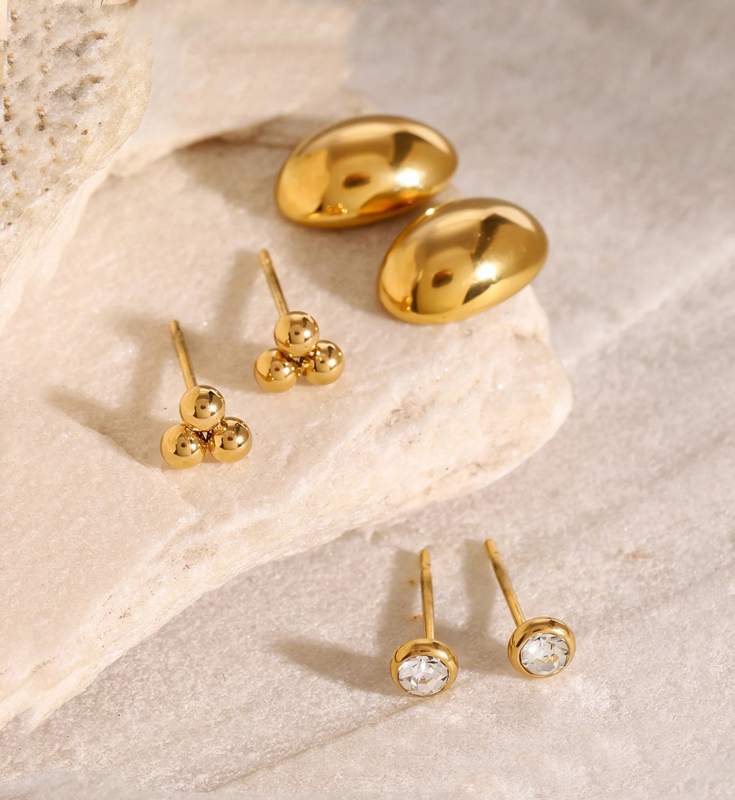 Minimalist waterproof stainless steel stud set on marble stone by Liora Senar