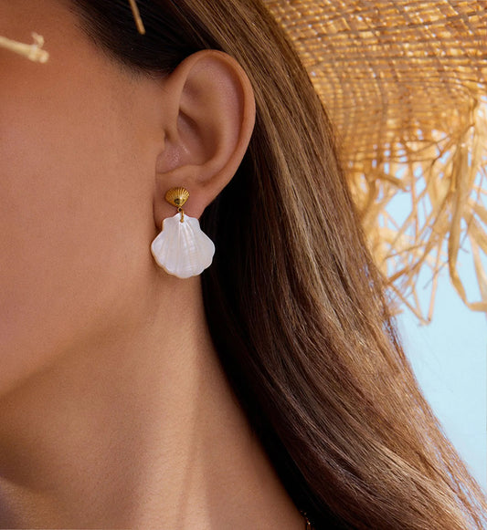 Natural Shell Dangle Earrings on a model minimalist waterproof stainless steel jewelry by Liora Senar