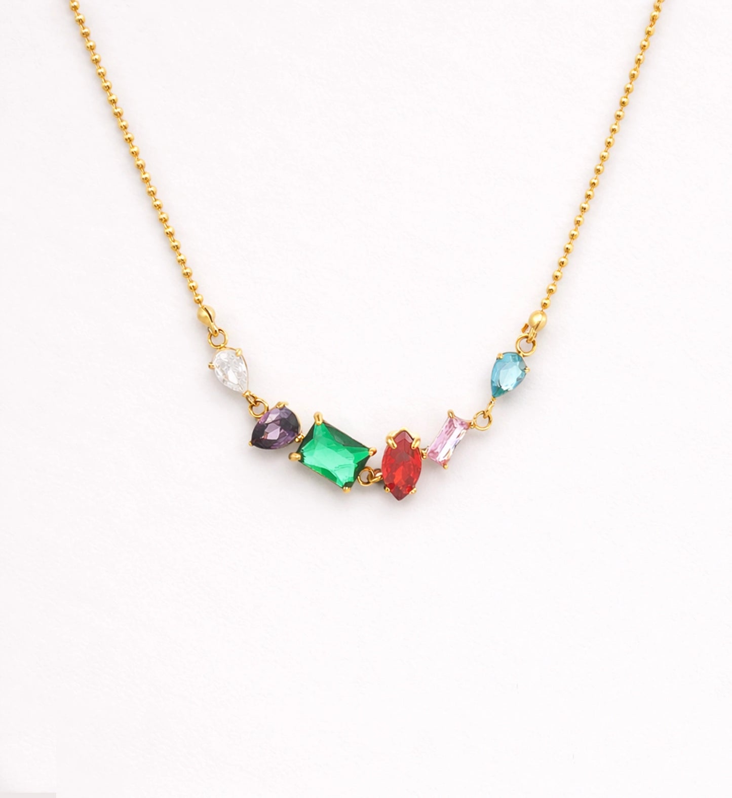 Liora Senar rainbow birthstone gold necklace on neutral background