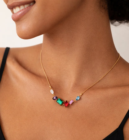 Liora Senar rainbow birthstone necklace on collarbone