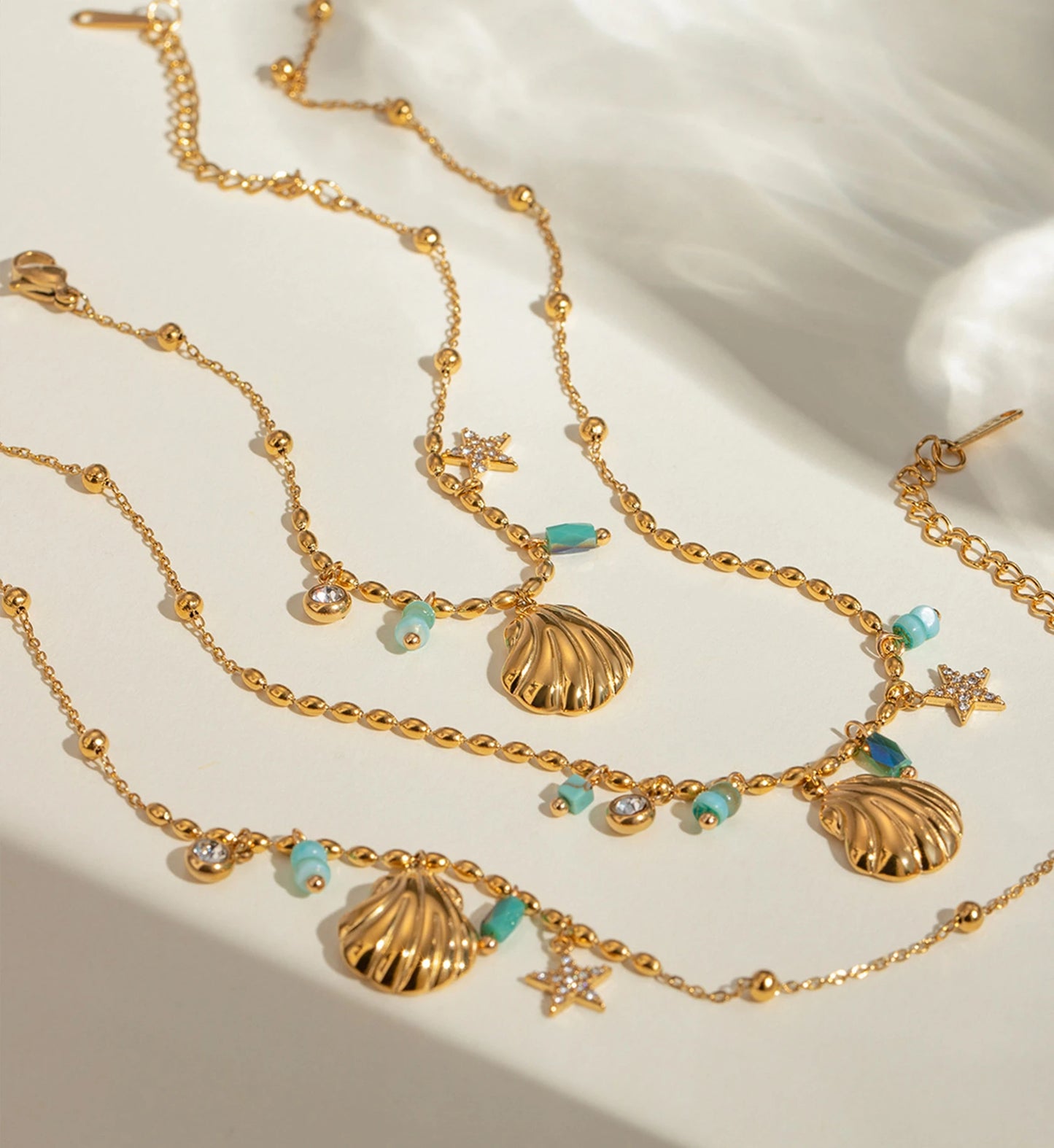 Stainless Steel tarnish-free Seashell Star Necklace and Bracelet Bundle in white background by Liora Senar