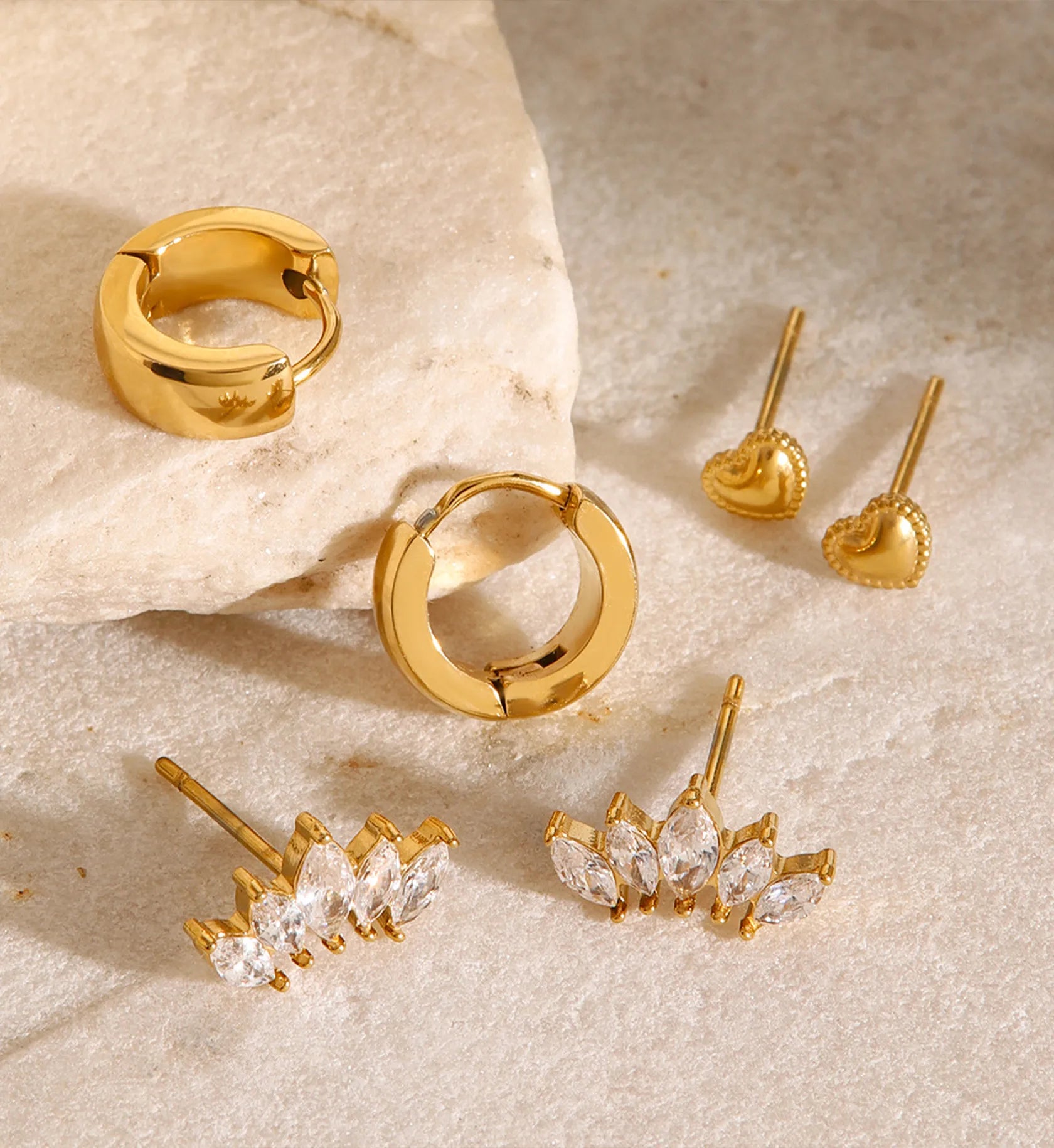 Minimalist versatile heart earrings set in life style background by liora senar