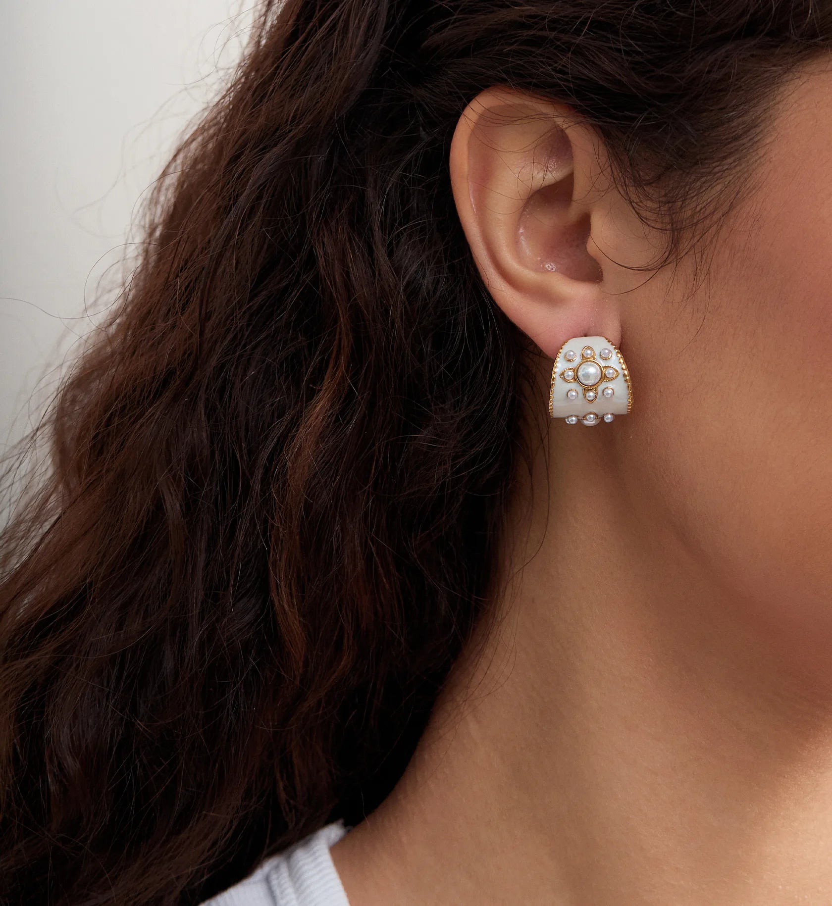 Model wearing hypoallergenic Vintage Drip Oil Pearl Earrings by Liora Senar